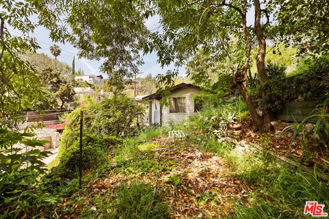 a view of a house with a tree