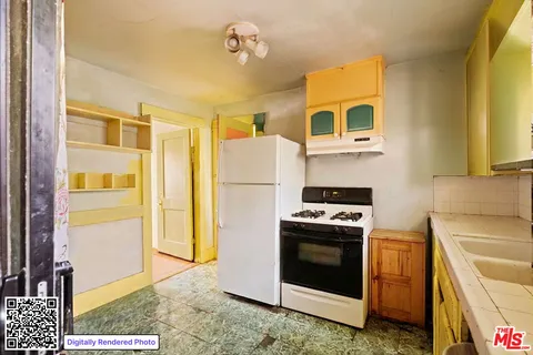 a kitchen with a stove and a refrigerator