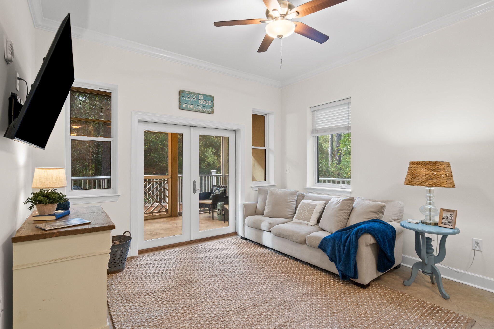 231 Somerset Bridge Road, Unit 2101 Santa Rosa Beach, FL 32459 - Photo 12 of 48 a living room with furniture and a flat screen tv