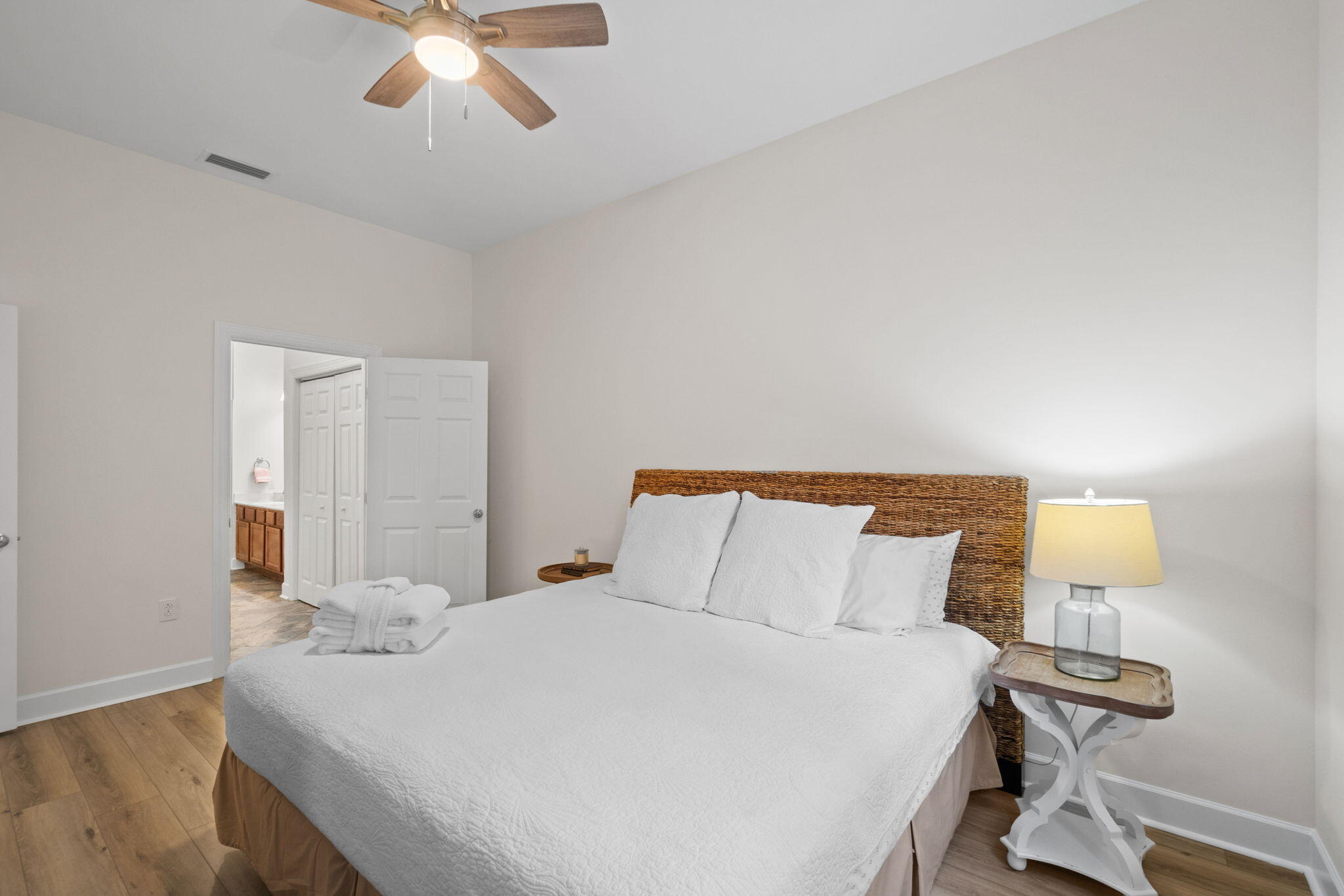 231 Somerset Bridge Road, Unit 2101 Santa Rosa Beach, FL 32459 - Photo 17 of 48 a bedroom with a bed and a lamp