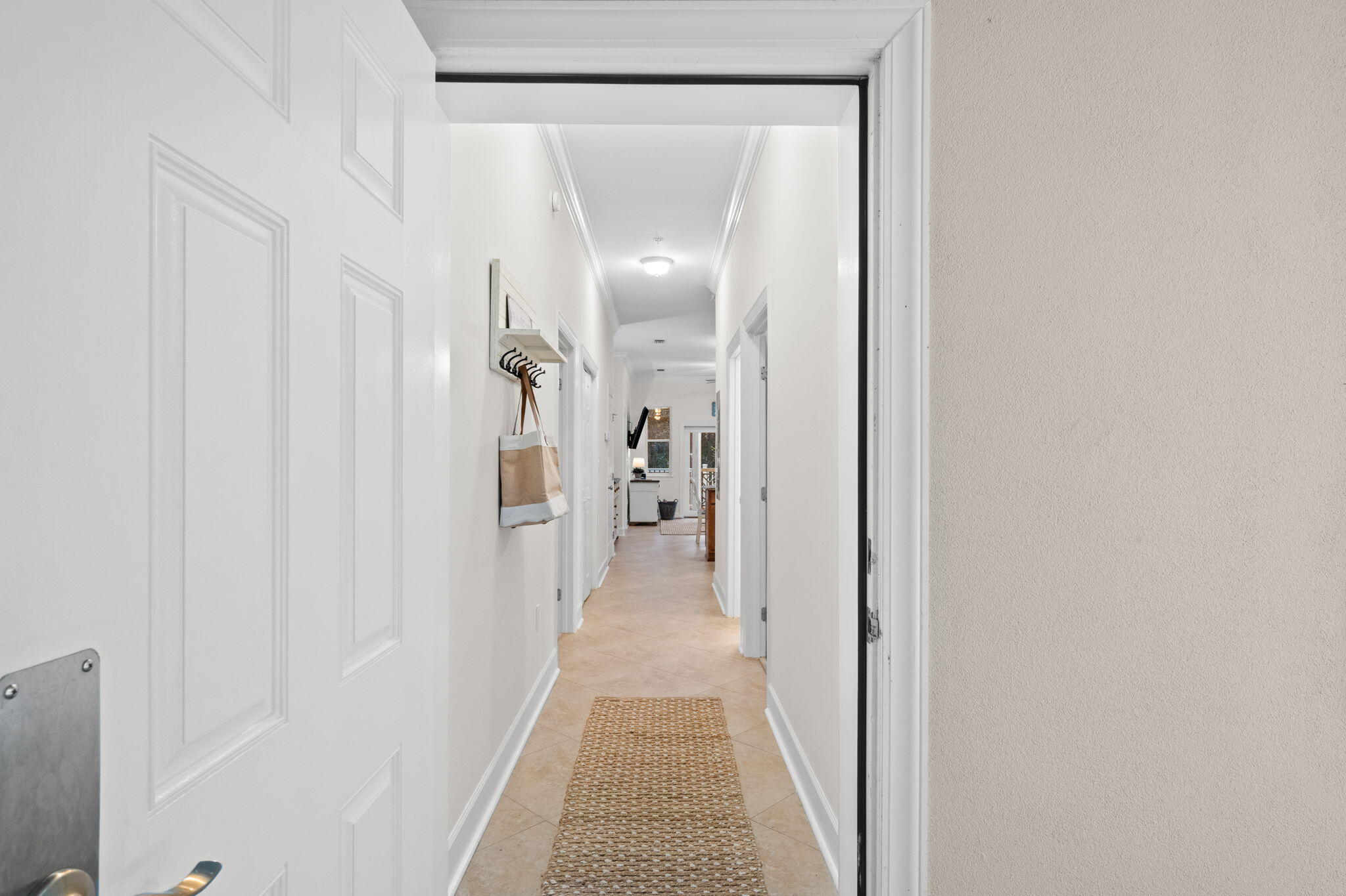 231 Somerset Bridge Road, Unit 2101 Santa Rosa Beach, FL 32459 - Photo 34 of 48 a view of a hallway with wooden floor and a bathroom