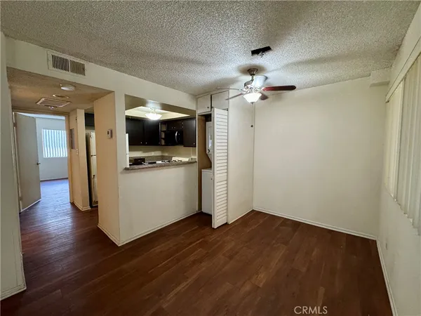 a view of a hallway with a kitchen