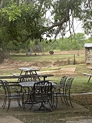 a view of a chairs and table on the deck