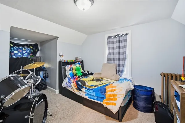 a bedroom with furniture and a window