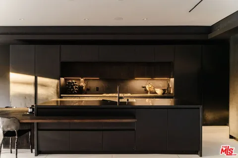 a kitchen with a sink and an oven