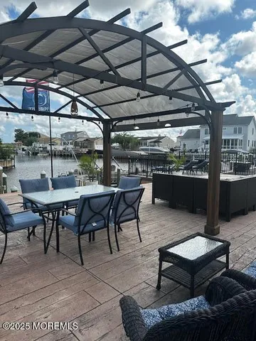 a view of a backyard with sitting area