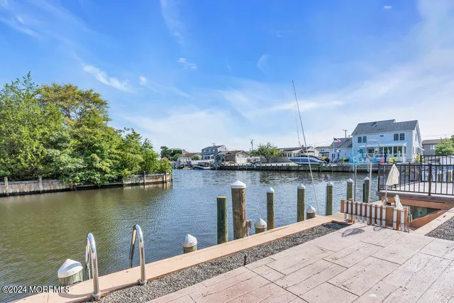 a big room with wooden floor and windows