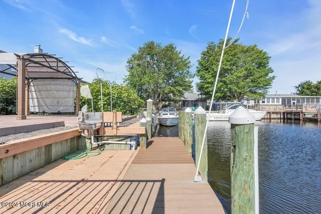 a living room with furniture rug and window