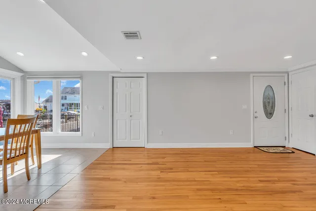 a view of kitchen with furniture and stainless steel appliances