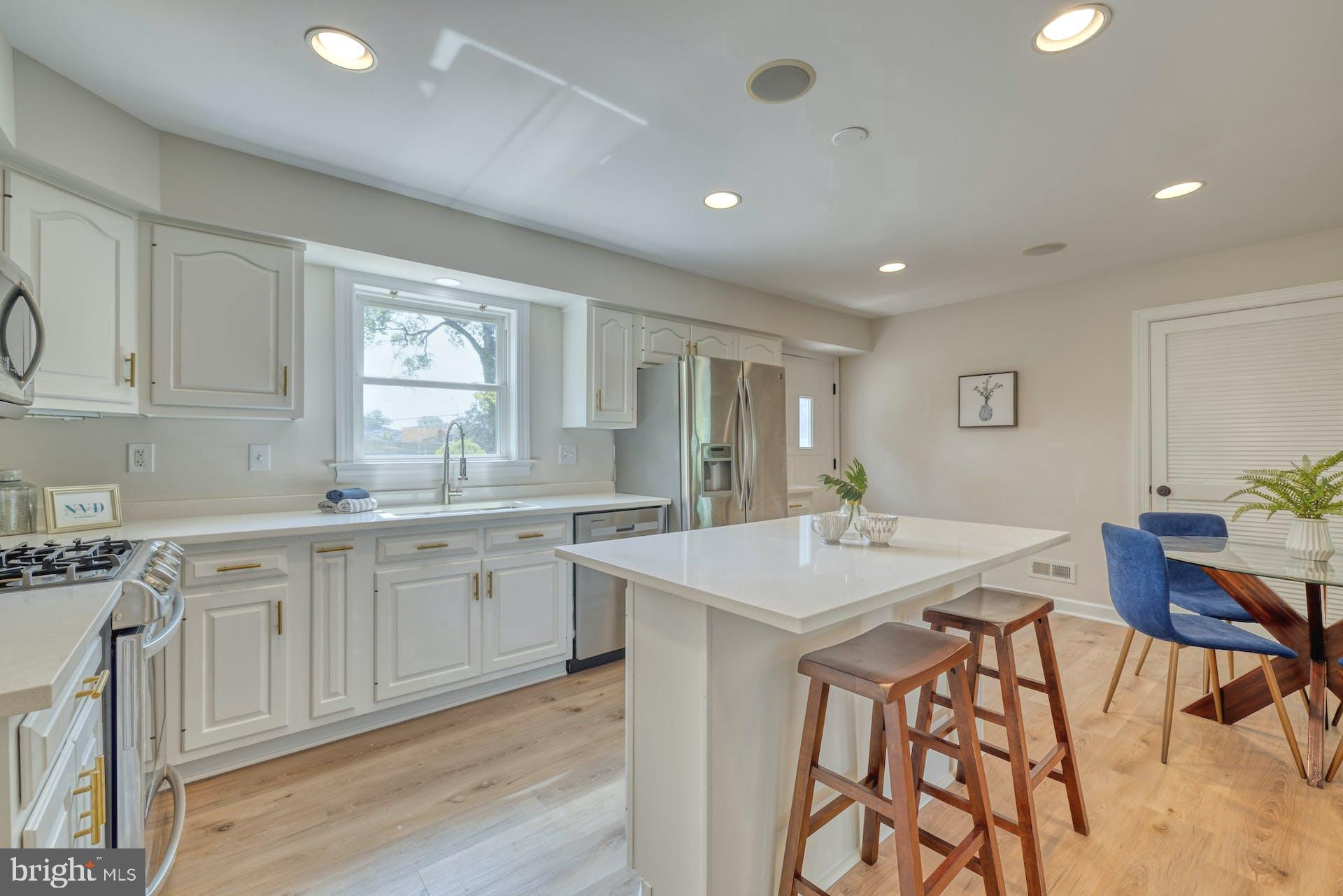 7716 Fordson Road Alexandria, VA 22306 - Photo 8 of 48 Bright kitchen w/ door to lush backyard and patio
