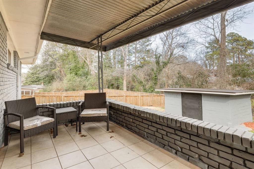 1944 Cindy Drive Decatur, GA 30032 - Photo 19 of 22 a roof deck with chairs and table