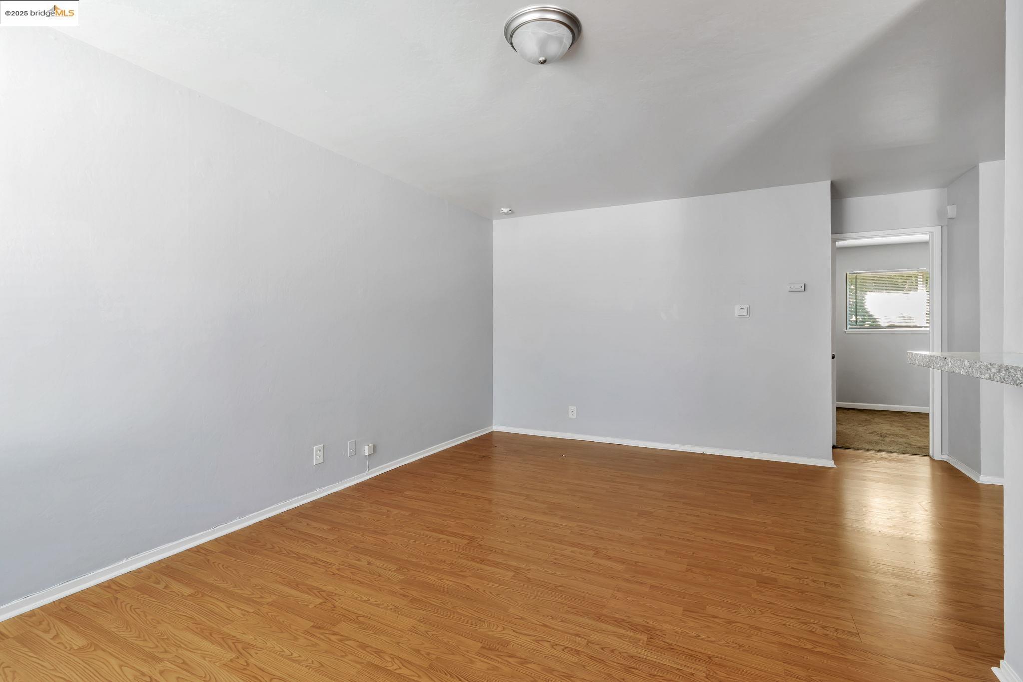 1626 Dwight Way Berkeley, CA 94703 - Photo 16 of 46 a view of an empty room with wooden floor