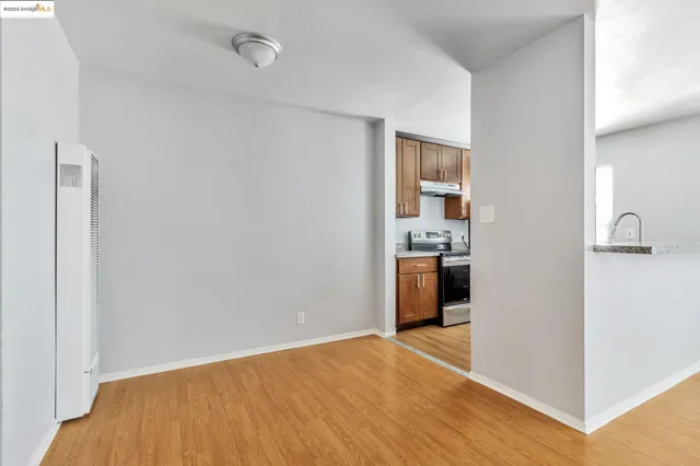 a view of a kitchen from an empty room