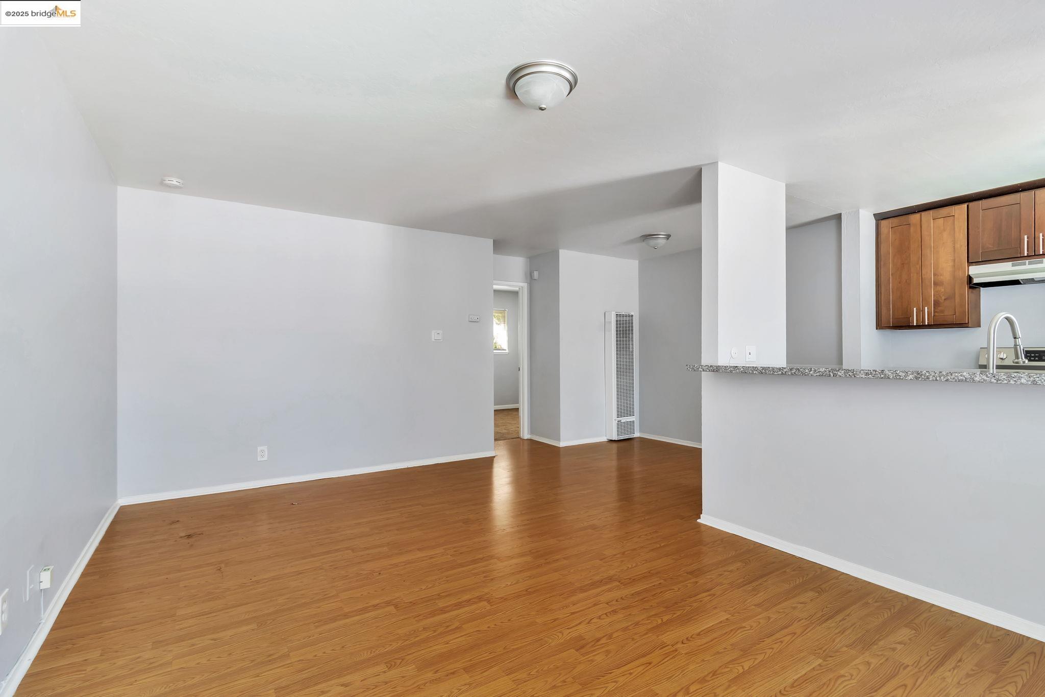 1626 Dwight Way Berkeley, CA 94703 - Photo 19 of 46 a view of an empty room with wooden floor