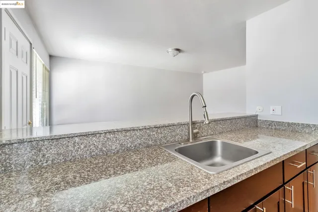 a close view of a sink and a vanity in the bathroom