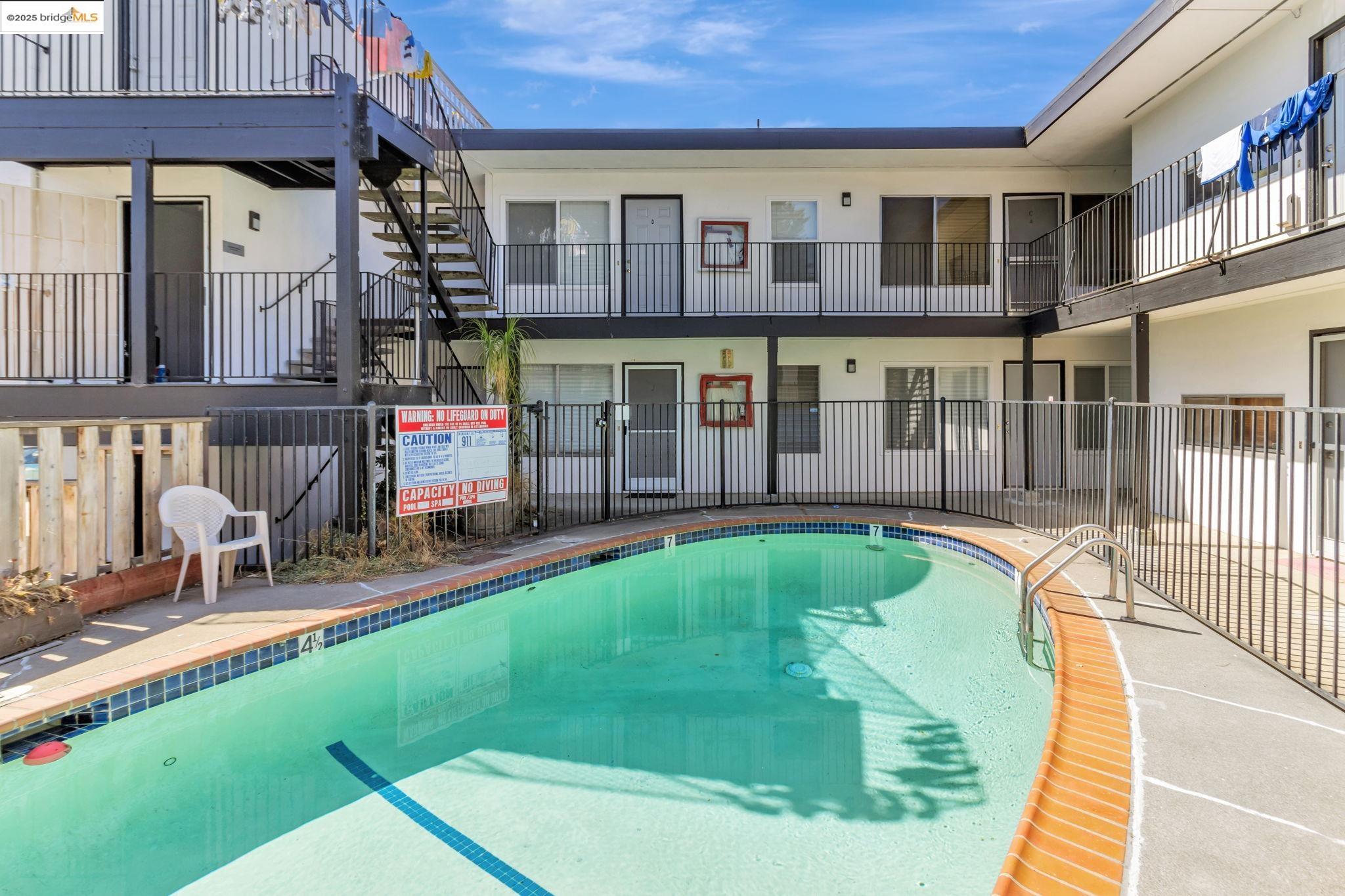 1626 Dwight Way Berkeley, CA 94703 - Photo 27 of 46 a swimming pool with patio outdoor seating and yard
