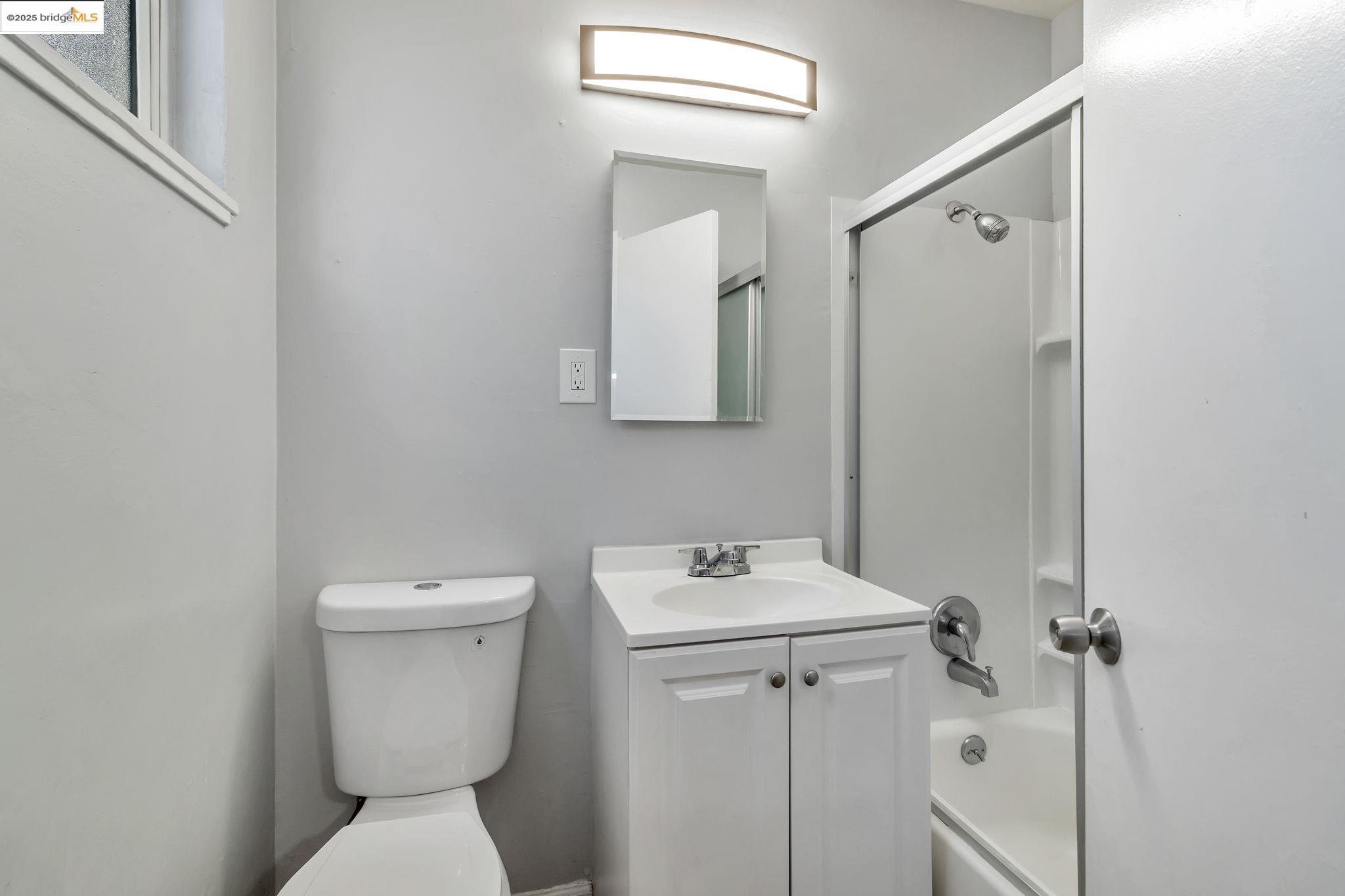 1626 Dwight Way Berkeley, CA 94703 - Photo 31 of 46 a bathroom with a toilet sink and mirror