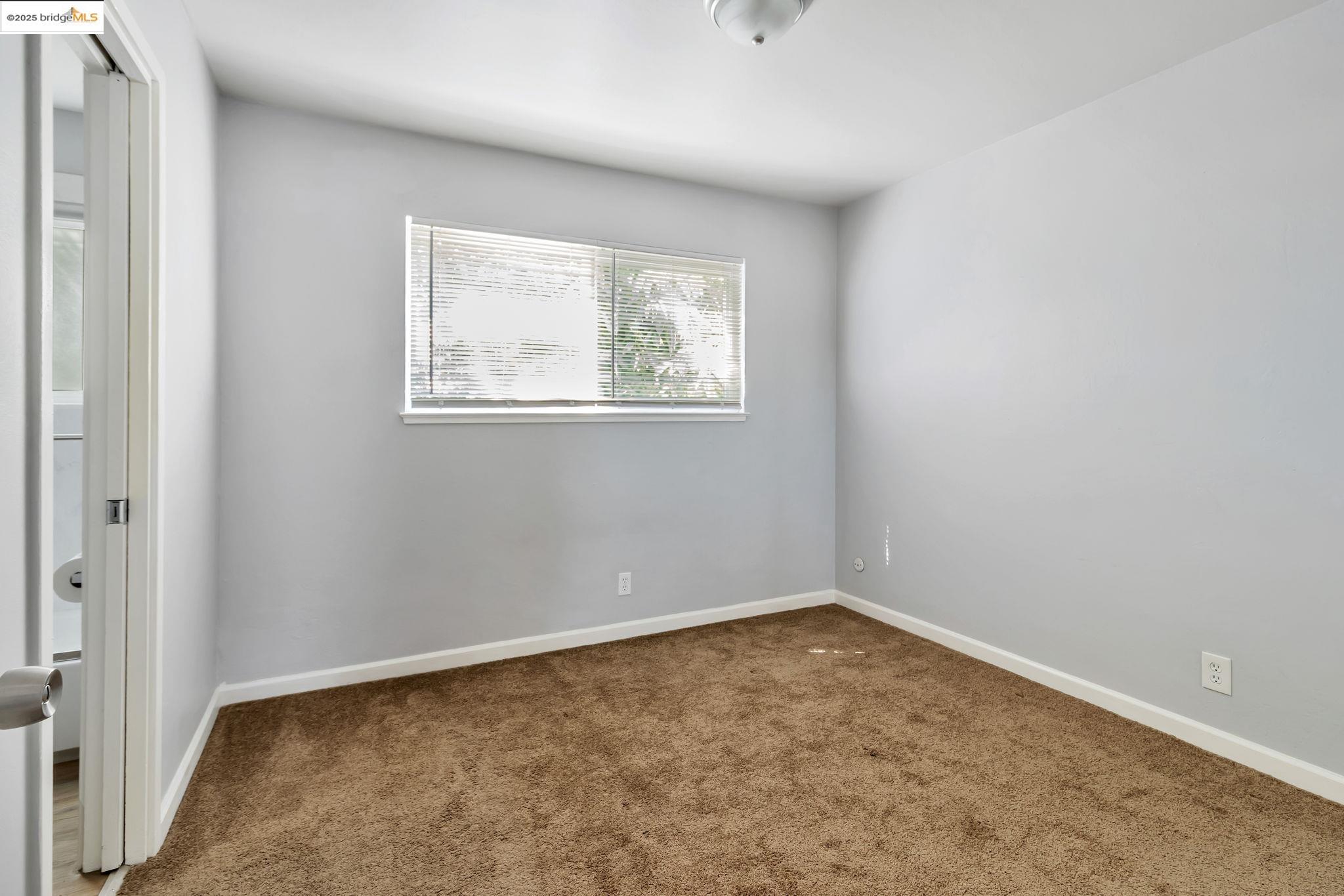 1626 Dwight Way Berkeley, CA 94703 - Photo 36 of 46 an empty room with a window