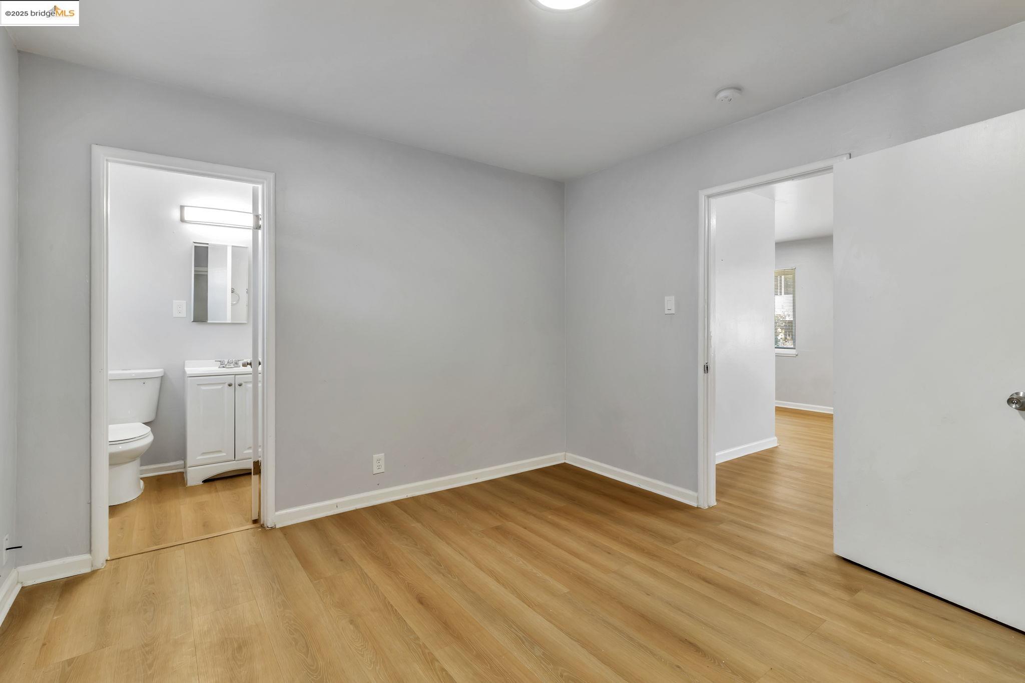 1626 Dwight Way Berkeley, CA 94703 - Photo 39 of 46 a view of a room with wooden floor and a toilet