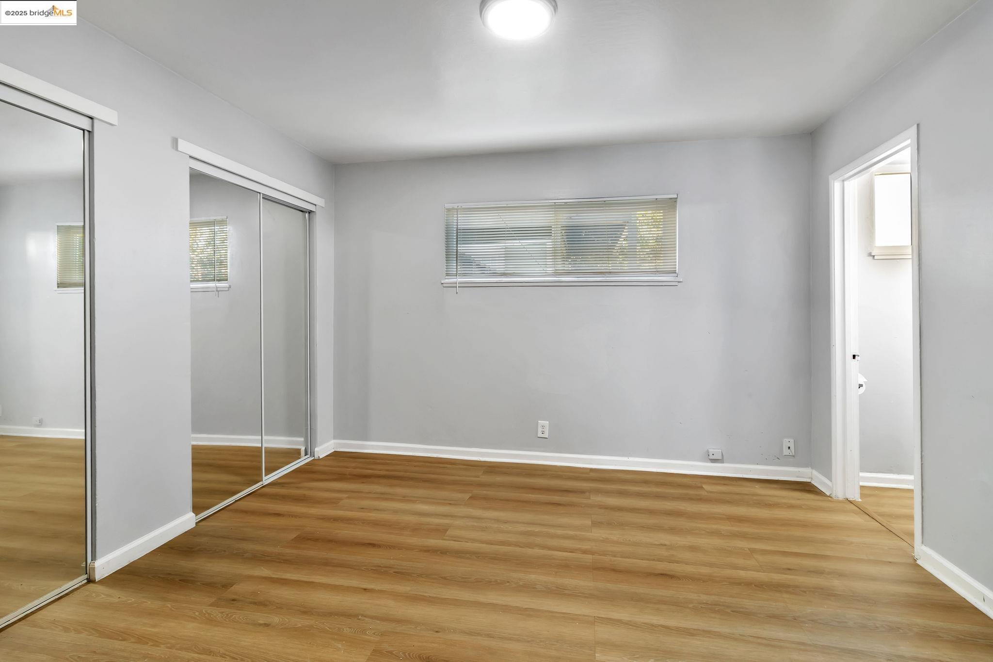 1626 Dwight Way Berkeley, CA 94703 - Photo 41 of 46 a view of an empty room with wooden floor