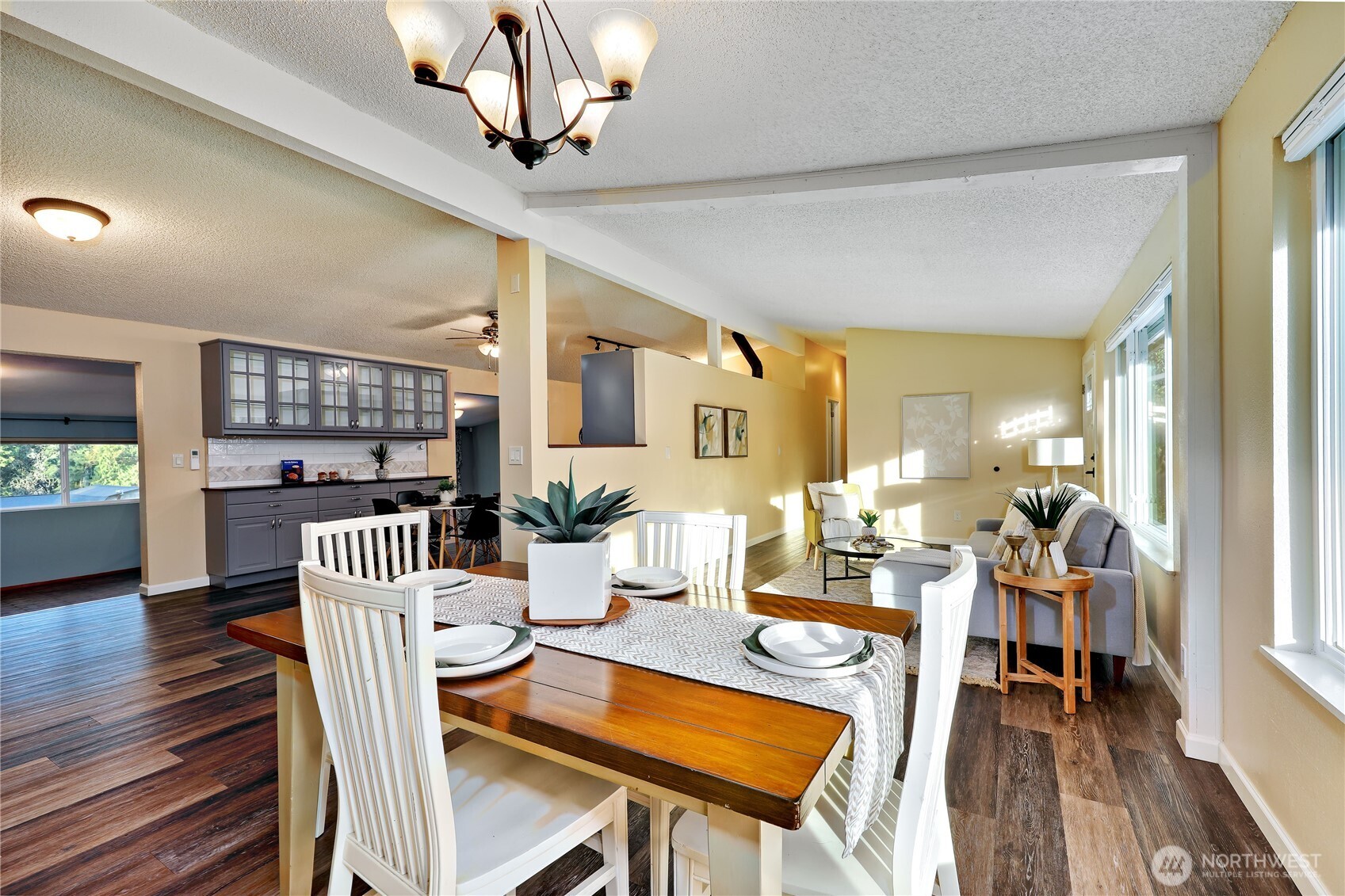 12161 South Keyport Road Northeast Poulsbo, WA 98370 - Photo 14 of 40 a living room with furniture a dining table and a wooden floor