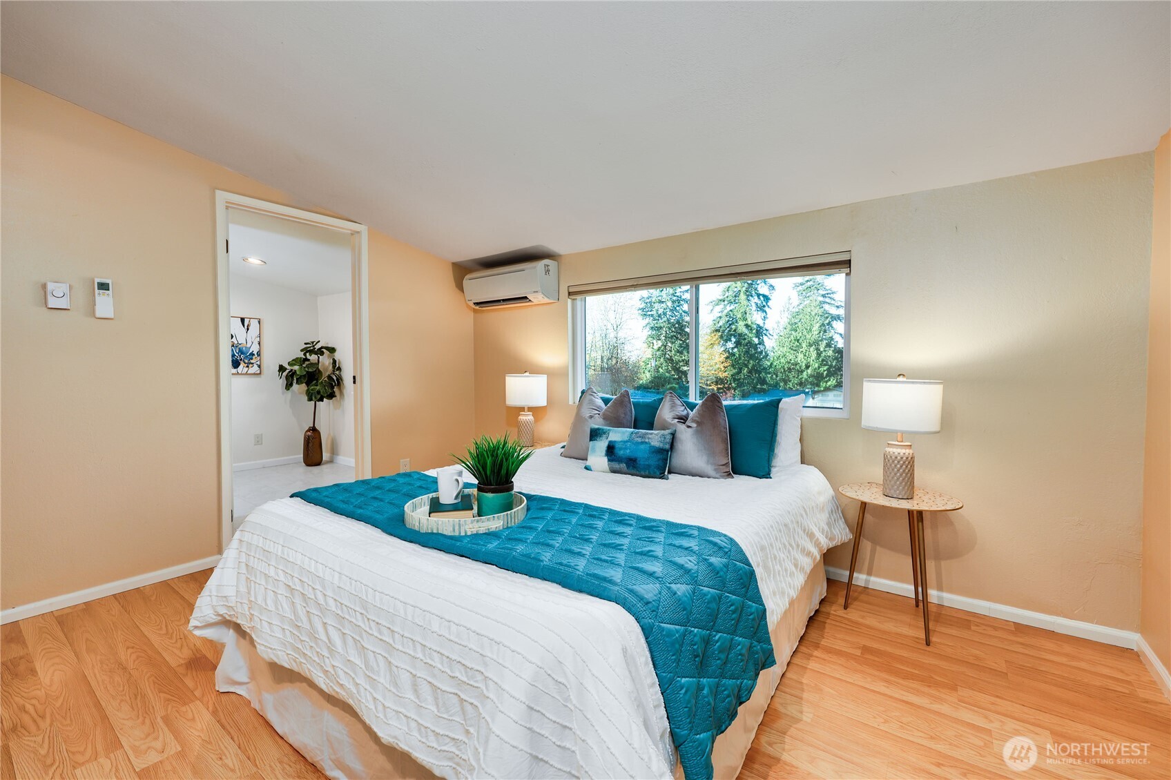 12161 South Keyport Road Northeast Poulsbo, WA 98370 - Photo 18 of 40 a bedroom with a bed lamp on table and a window