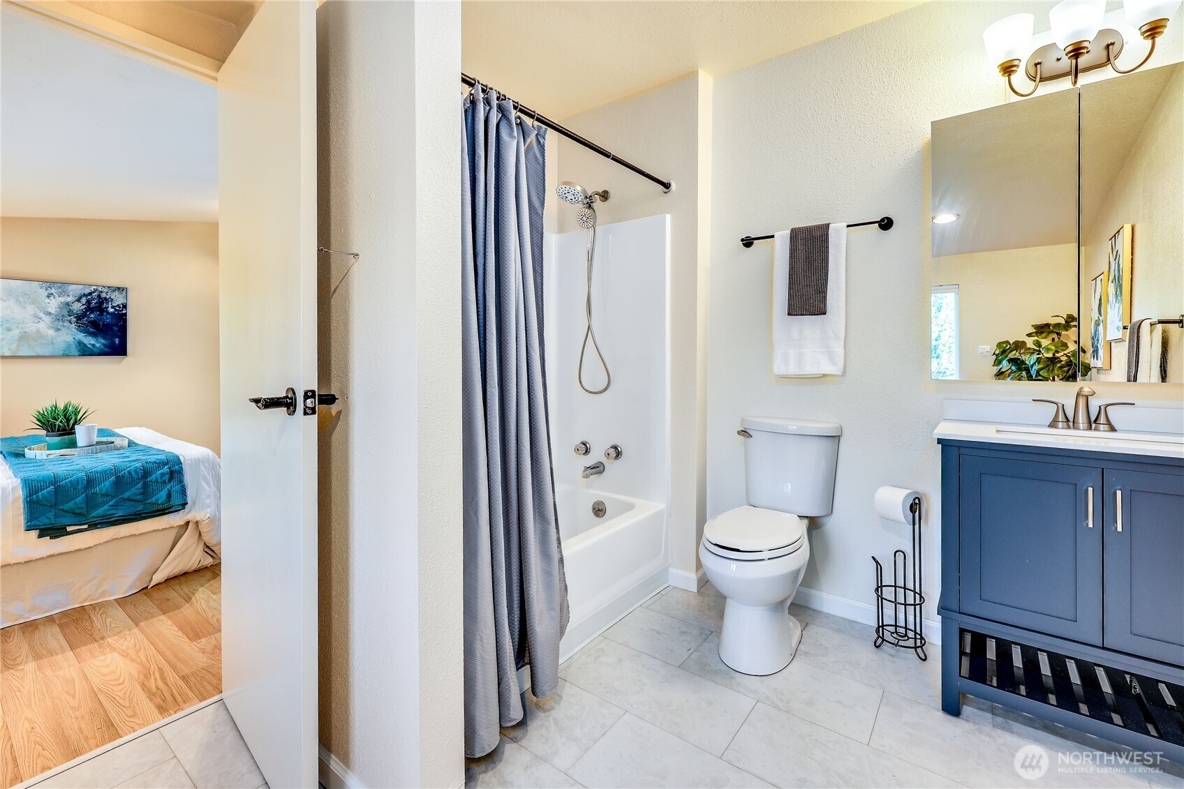 12161 South Keyport Road Northeast Poulsbo, WA 98370 - Photo 19 of 40 a bathroom with a toilet a sink and a shower