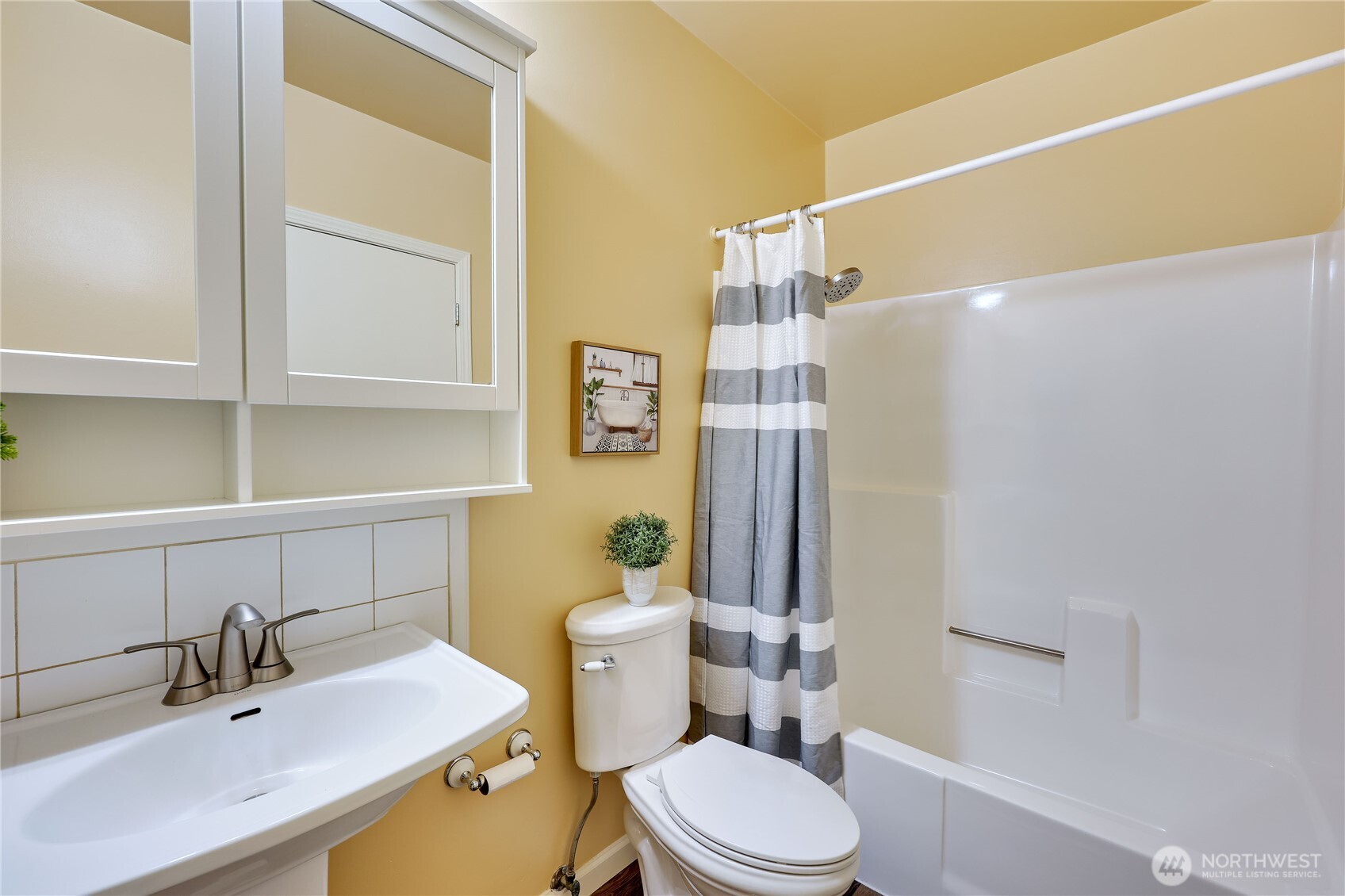 12161 South Keyport Road Northeast Poulsbo, WA 98370 - Photo 22 of 40 a bathroom with a sink a toilet and shower