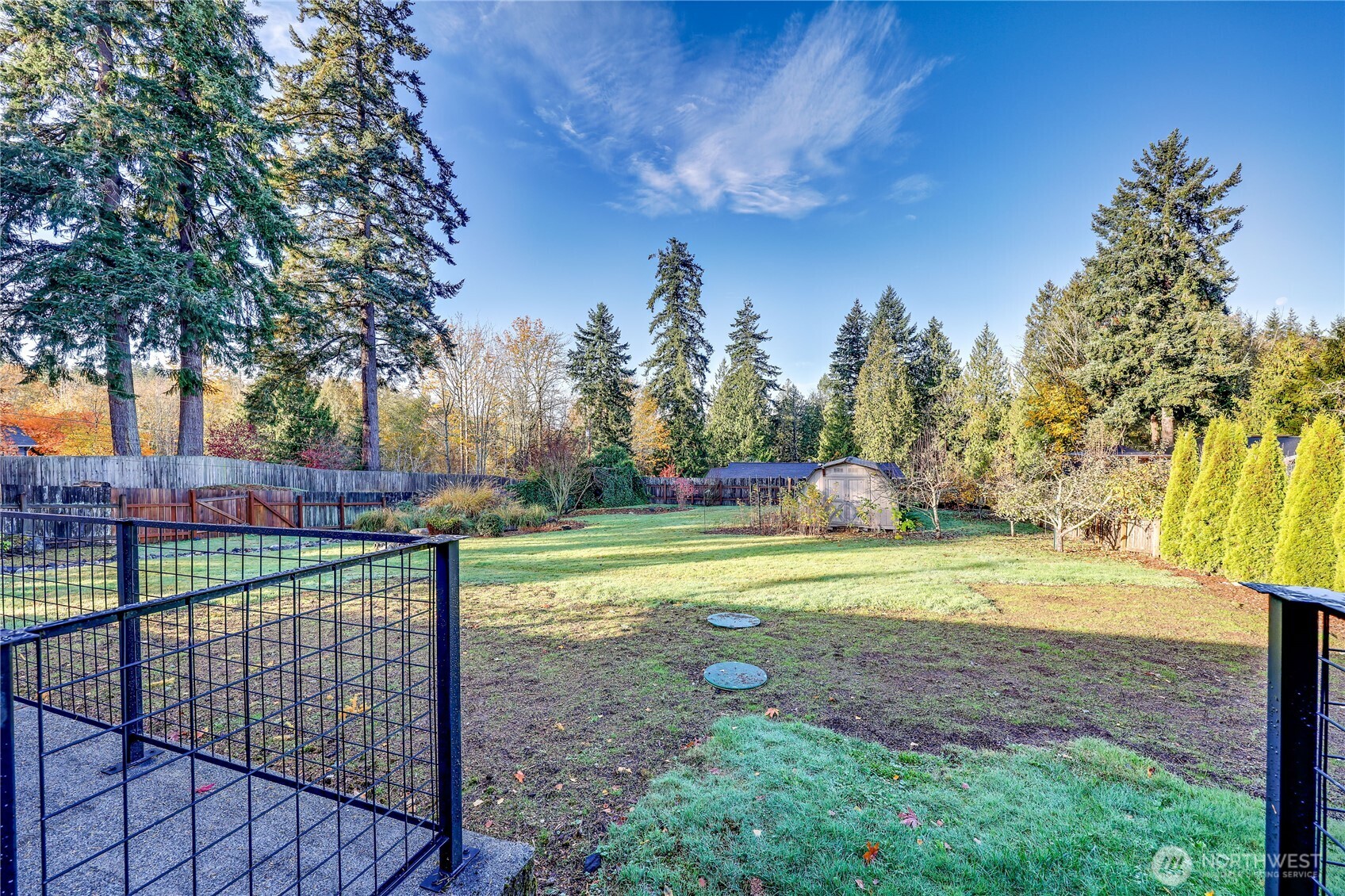 12161 South Keyport Road Northeast Poulsbo, WA 98370 - Photo 28 of 40 a view of outdoor space with garden and trees
