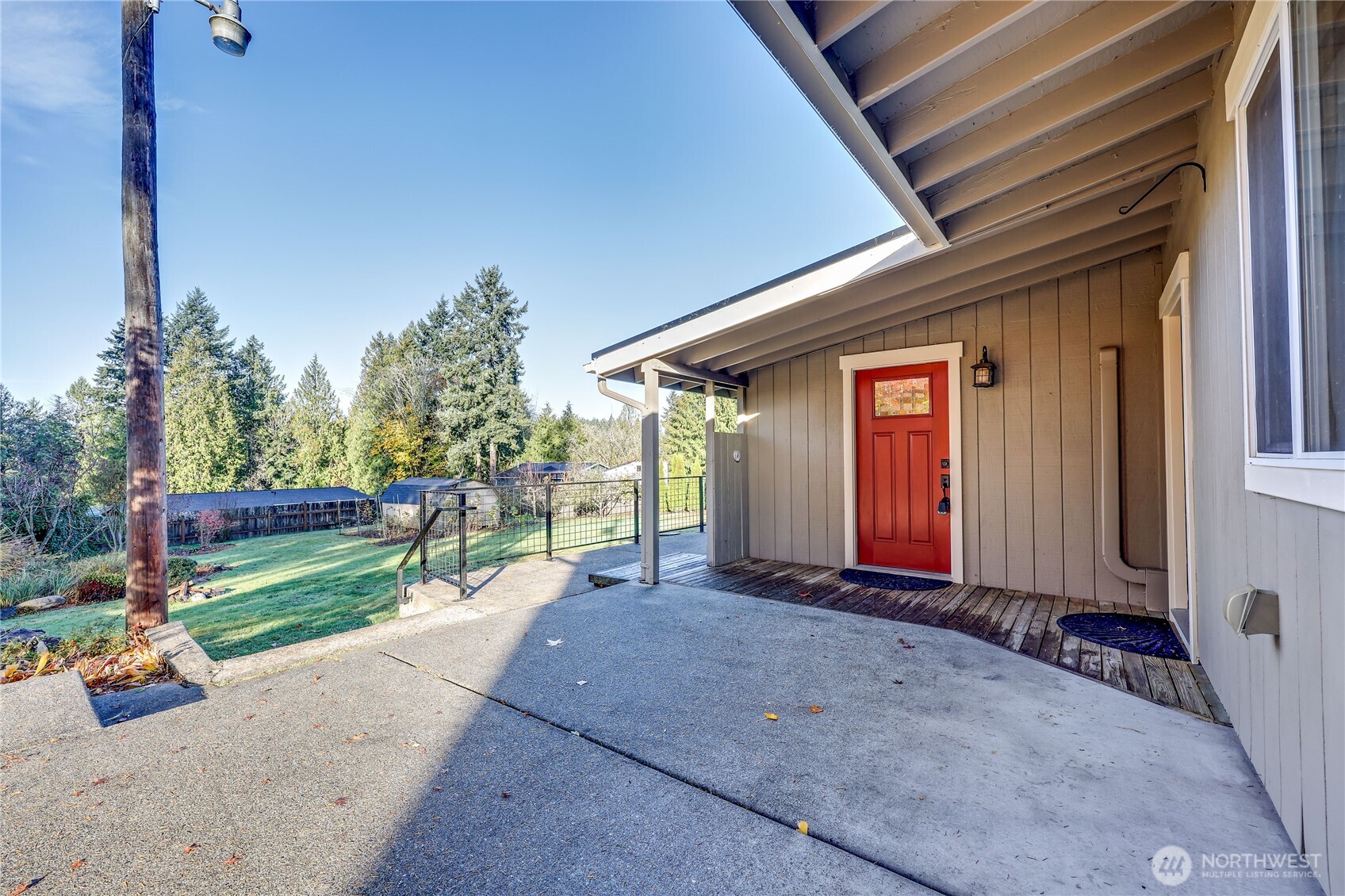 12161 South Keyport Road Northeast Poulsbo, WA 98370 - Photo 3 of 40 a view of a house with backyard and porch