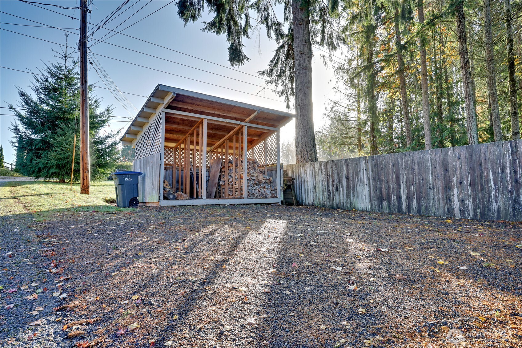 12161 South Keyport Road Northeast Poulsbo, WA 98370 - Photo 34 of 40 a view of outdoor space and wooden fence