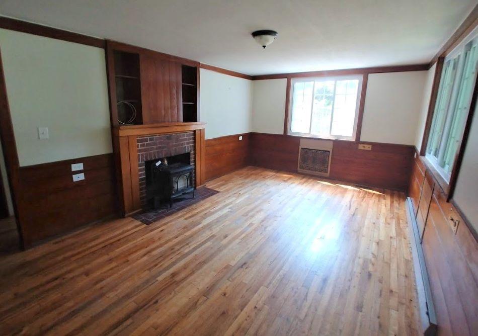 131 Orchard Road Norris, TN 37828 - Photo 4 of 19 Living room with woodburning stove