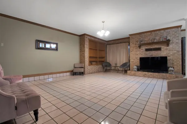 a view of a livingroom with furniture and a fireplace