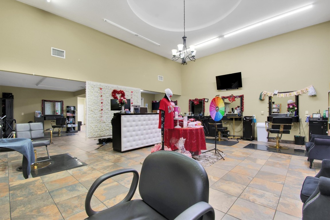 416 Depot Street Elgin, TX 78621 - Photo 8 of 21 Miscellaneous room featuring a towering ceiling and a chandelier