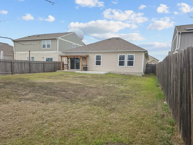 a view of a yard in front of a house with a yard