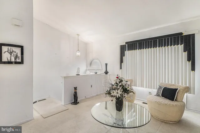 a view of a livingroom with furniture and a fireplace