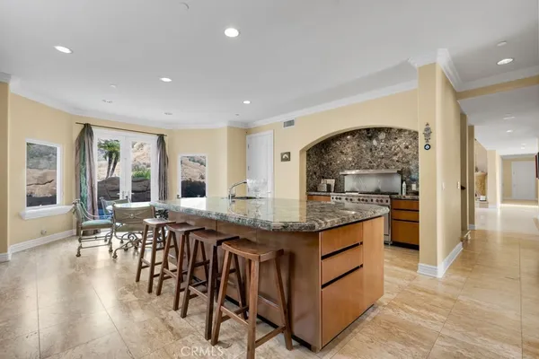 a kitchen with granite countertop lots of counter top space and dining table