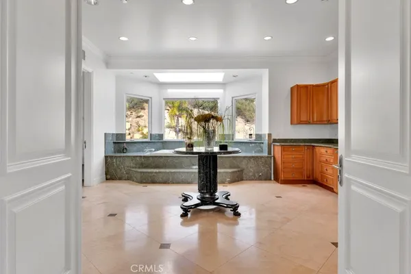 a living room with a large window and gym equipment