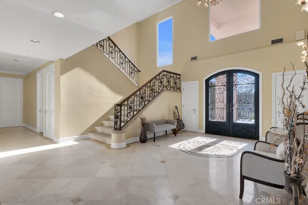 a view of entryway and hall with a front door