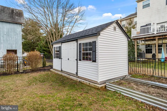 a view of a white house with many windows