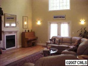 288 Patternote Road Mooresville, NC 28117 - Photo 2 of 8 a living room with furniture and a fireplace