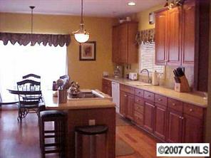 288 Patternote Road Mooresville, NC 28117 - Photo 3 of 8 a kitchen with a sink cabinets and window
