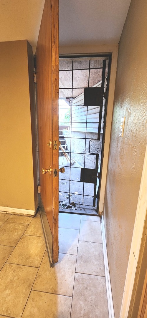 7227 South Bennett Avenue Chicago, IL 60649 - Photo 44 of 47 a view of entryway with a door and wooden floor