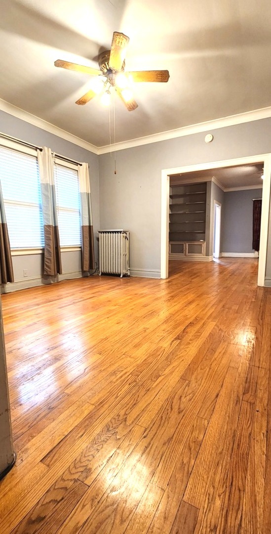 7227 South Bennett Avenue Chicago, IL 60649 - Photo 7 of 47 a view of an empty room with a window and kitchen view