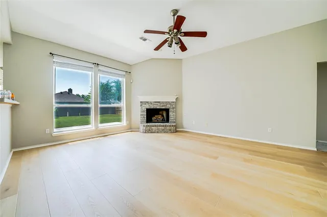 a view of room window and a ceiling fan