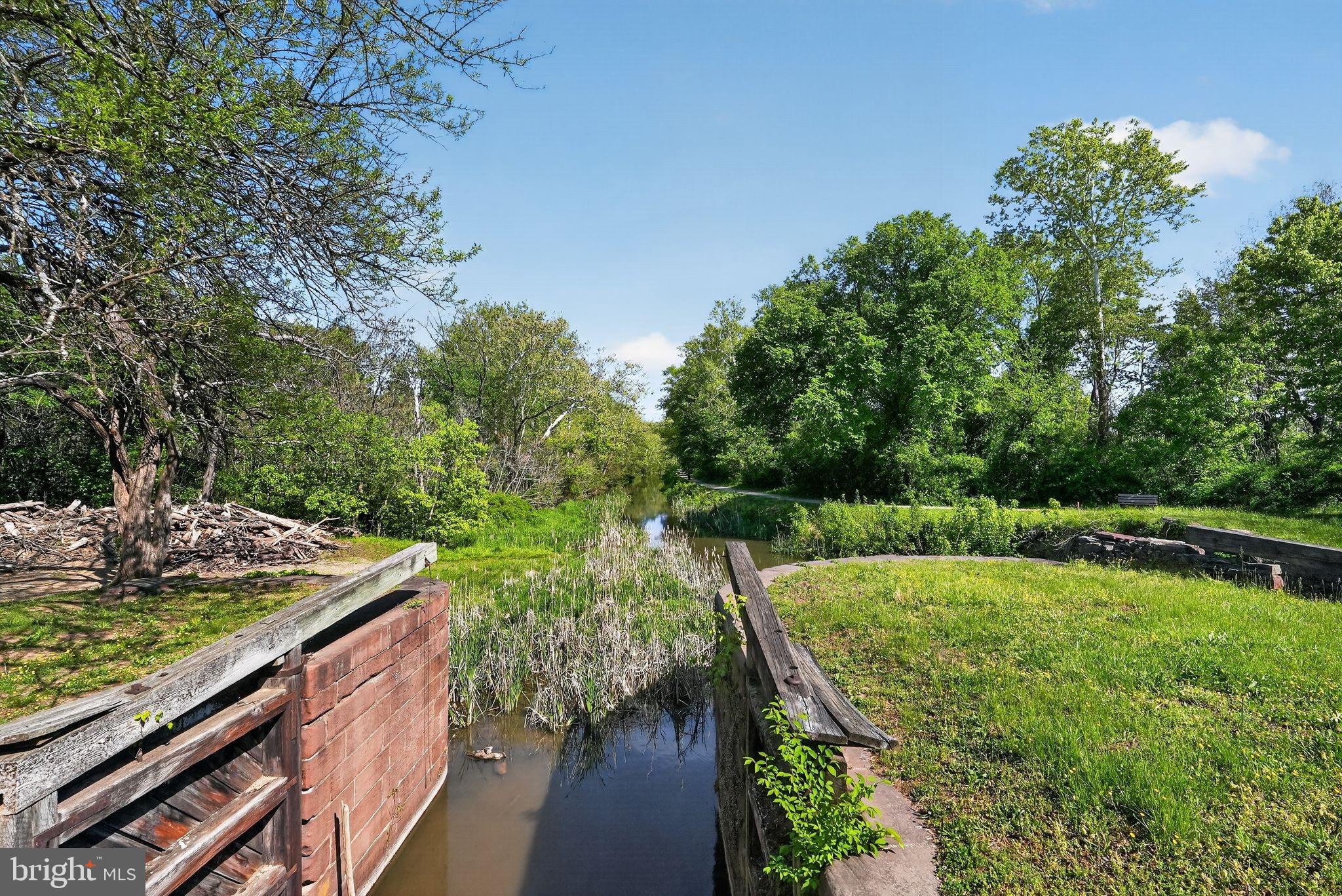 13821 Esworthy Road Darnestown, MD 20874 - Photo 85 of 98 a view of a wooden deck and lake view