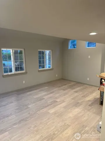 a view of empty room with windows