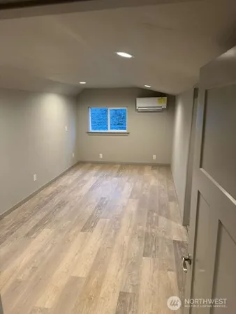 an empty room with a wooden door