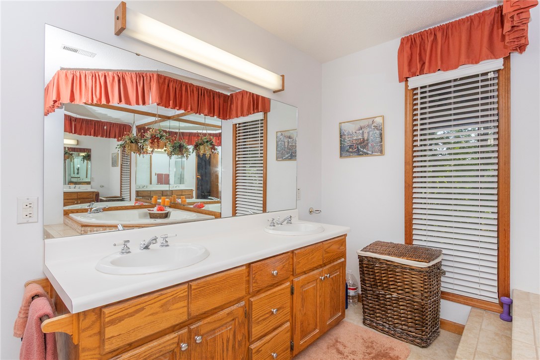 202 Plantation Point Anderson, SC 29625 - Photo 27 of 48 Double vanity and a soaking tub create a personal spa-like experience in this private bathroom.
