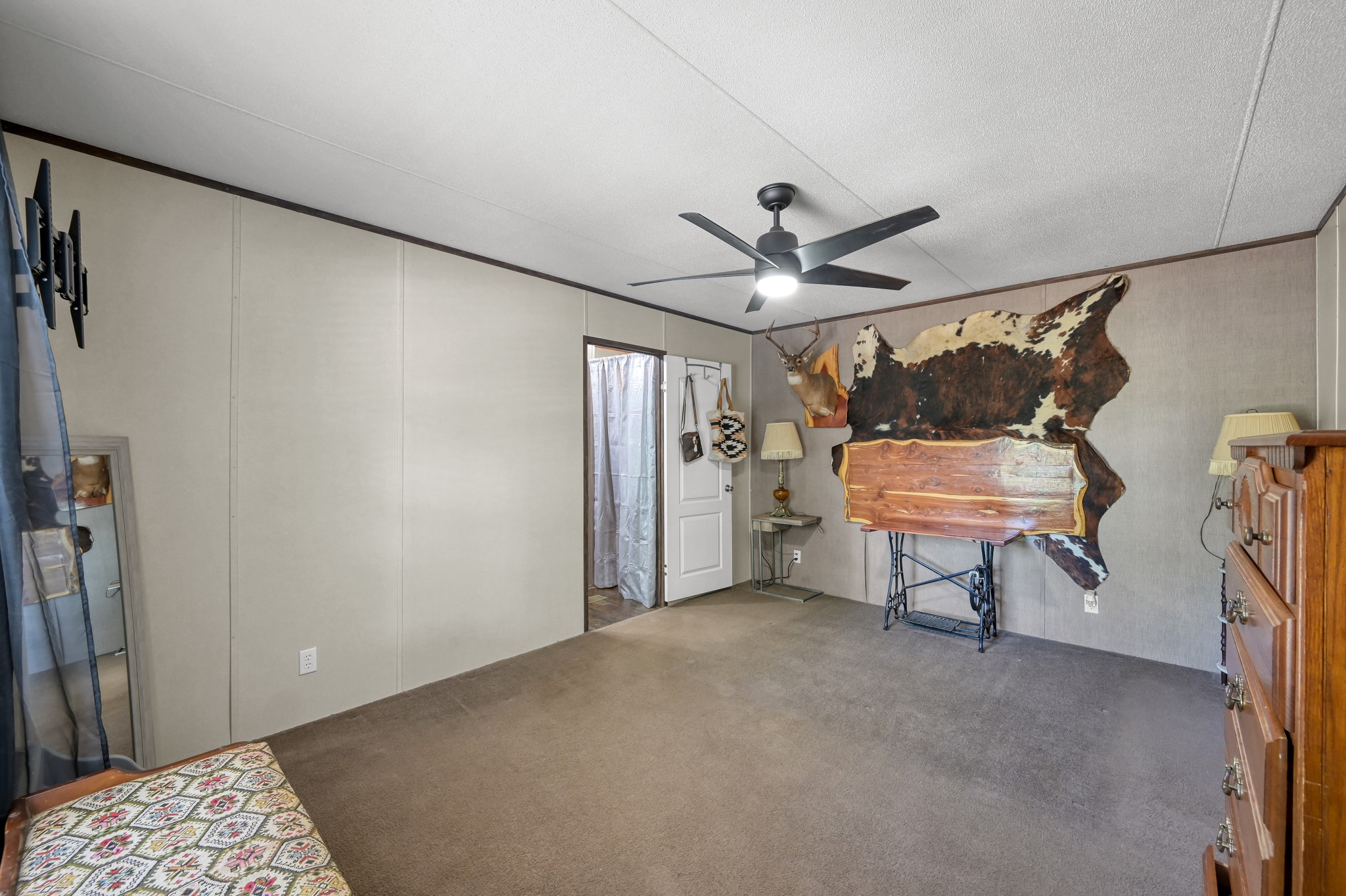 400 Raven Hill Road Oakhurst, TX 77359 - Photo 21 of 45 a bedroom with furniture and window